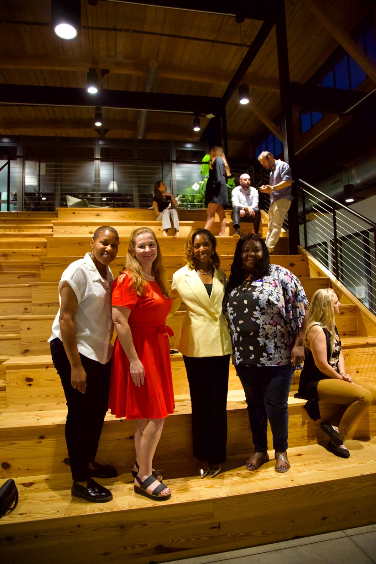 Joanna Reese and guests smiling together at GVL Connect during Courtney McClain’s visit